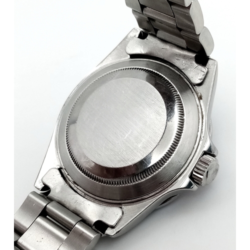 53 - A Custom Rolex Submariner Watch with Rainbow Gem-Set Bezel. Stainless steel diamond set bracelet and... 