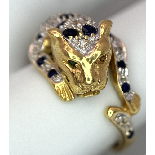 54 - An 18K YELLOW GOLD DIAMOND AND SAPPHIRE SET PANTHER RING. ONE STONE MISSING. 4.6G SIZE L. Ref: 9983