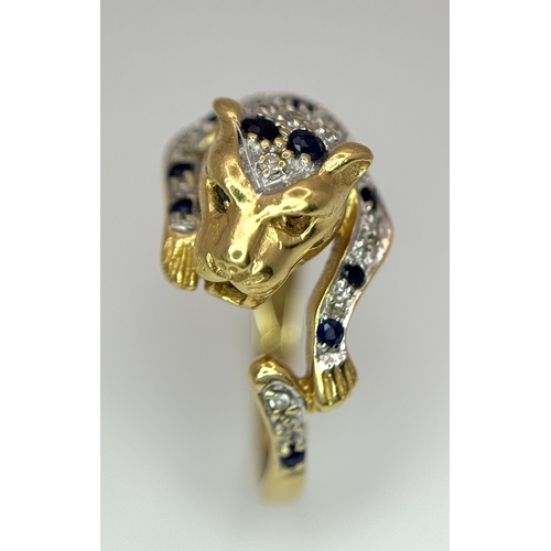 54 - An 18K YELLOW GOLD DIAMOND AND SAPPHIRE SET PANTHER RING. ONE STONE MISSING. 4.6G SIZE L. Ref: 9983