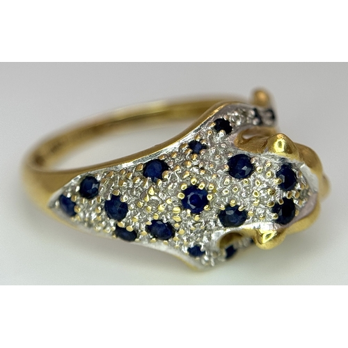 54 - An 18K YELLOW GOLD DIAMOND AND SAPPHIRE SET PANTHER RING. ONE STONE MISSING. 4.6G SIZE L. Ref: 9983