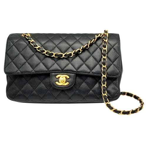 A Chanel Black Caviar Leather Classic Double Flap Bag. Black caviar leather exterior with gold-toned hardware, leather-and-chain shoulder straps and turn-lock closure. Burgundy leather interior with double-flap design featuring a zipped pocket under the outer flap, a main compartment and two slip pockets. Some signs of wear and stains exterior, some scratches exterior. Approx 25cm length x 16cm height x 6cm depth. Please see photos or request a condition report.  STK025776