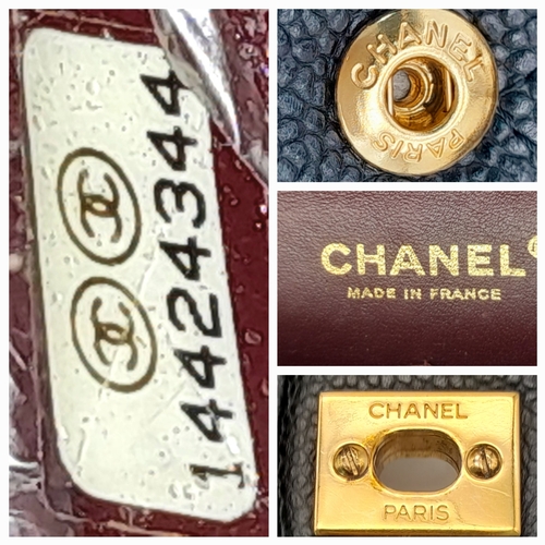 55 - A Chanel Black Caviar Leather Classic Double Flap Bag. Black caviar leather exterior with gold-toned... 