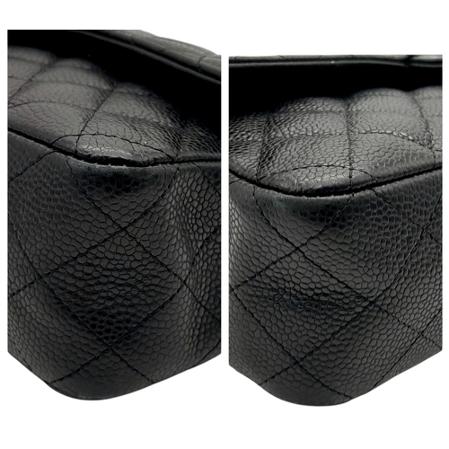 55 - A Chanel Black Caviar Leather Classic Double Flap Bag. Black caviar leather exterior with gold-toned... 