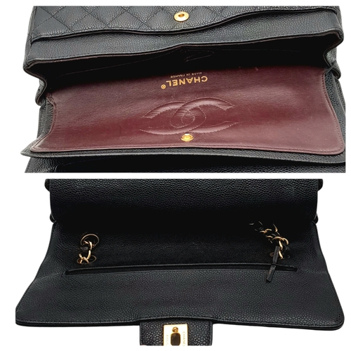 55 - A Chanel Black Caviar Leather Classic Double Flap Bag. Black caviar leather exterior with gold-toned... 