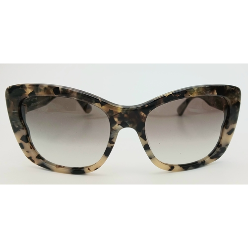 488 - A Pair of Miu Miu Designer Ladies Sunglasses. Comes with original box.  STK025780