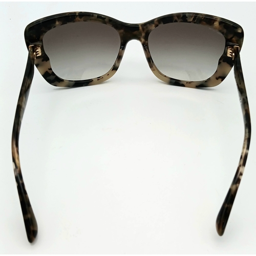 488 - A Pair of Miu Miu Designer Ladies Sunglasses. Comes with original box.  STK025780