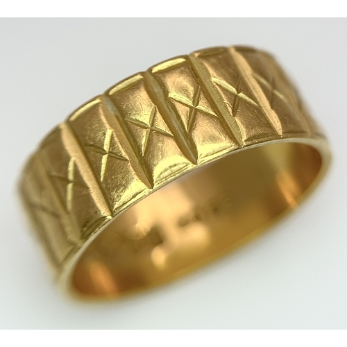 58 - A 22K GOLD BAND RING WITH THE X FACTOR DECORATION .    5.3gms    size J