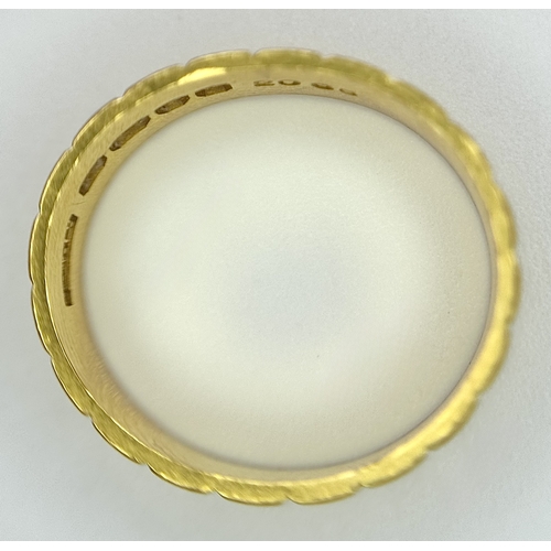 58 - A 22K GOLD BAND RING WITH THE X FACTOR DECORATION .    5.3gms    size J