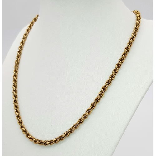9 - A 9K GOLD ROPE TWIST NECKLACE CHAIN .   10.6gms    44cms