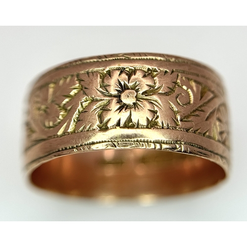 23 - A 9K ROSE GOLD DECORATED BAND RING , 8mm WIDTH     4.4gmd    size R