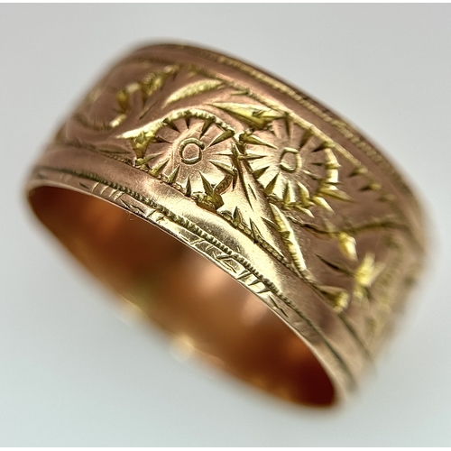 23 - A 9K ROSE GOLD DECORATED BAND RING , 8mm WIDTH     4.4gmd    size R