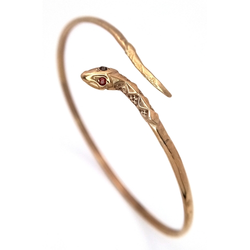 24 - A ONE EYED SNAKE BANGLE (ONE EYE STONE IS MISSING) .    4.76gms
