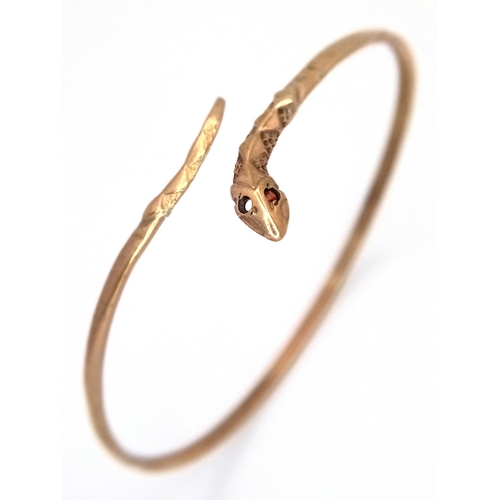 24 - A ONE EYED SNAKE BANGLE (ONE EYE STONE IS MISSING) .    4.76gms