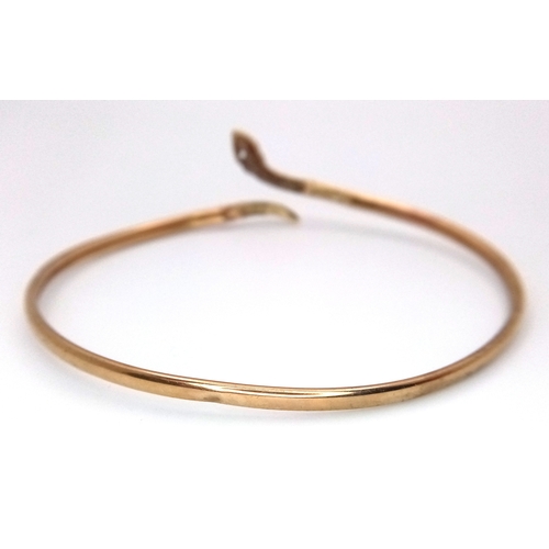 24 - A ONE EYED SNAKE BANGLE (ONE EYE STONE IS MISSING) .    4.76gms