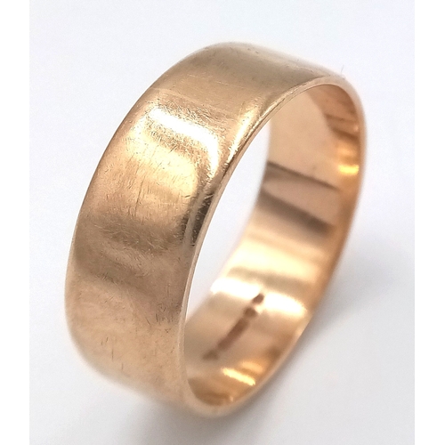73 - A 9K GOLD BAND RING .       5.7gms    size V
