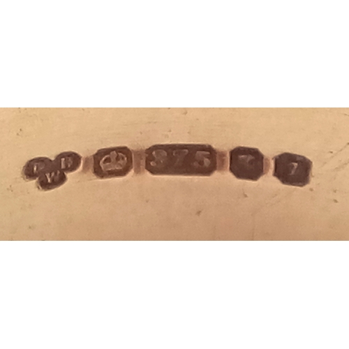 73 - A 9K GOLD BAND RING .       5.7gms    size V