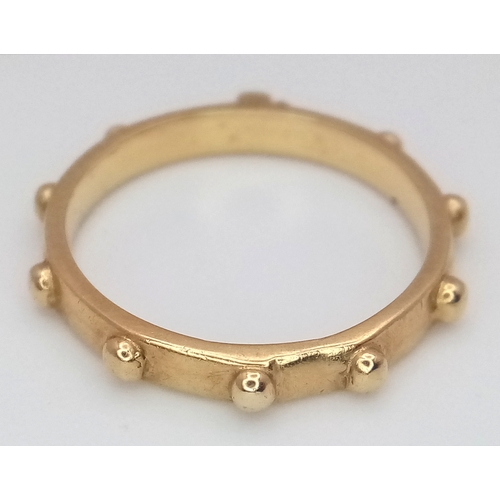 184 - An 18K Yellow Gold (tests as) Rosary Band Ring. 3mm width.  Size L. 2.5g.