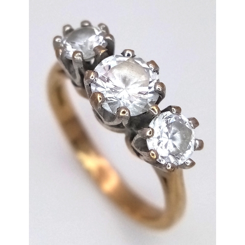 205 - A 9K Yellow Gold Three White Stone Ring. Size O 1/2. 3.6g total weight.