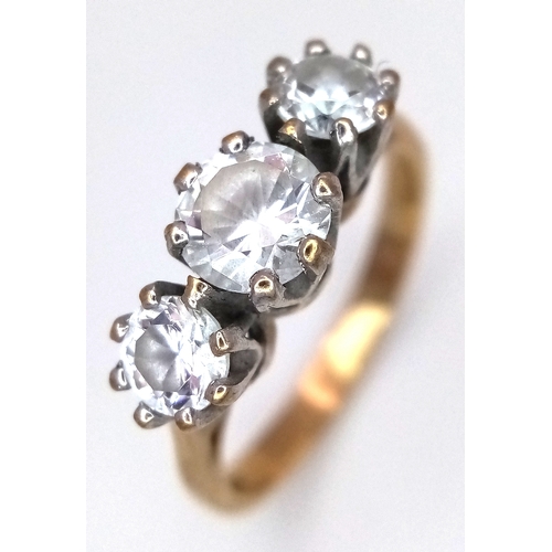 205 - A 9K Yellow Gold Three White Stone Ring. Size O 1/2. 3.6g total weight.