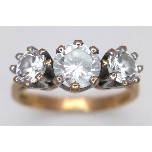205 - A 9K Yellow Gold Three White Stone Ring. Size O 1/2. 3.6g total weight.
