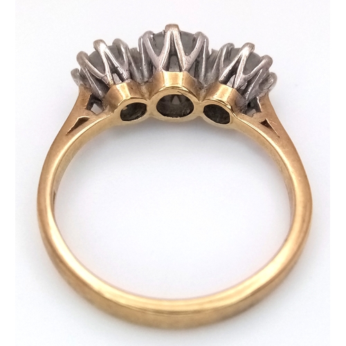 205 - A 9K Yellow Gold Three White Stone Ring. Size O 1/2. 3.6g total weight.