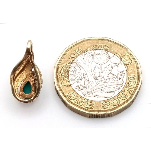 531 - A 14K Gold (tests as) Turquoise and Diamond Pendant. 15mm. 1.2g total weight.