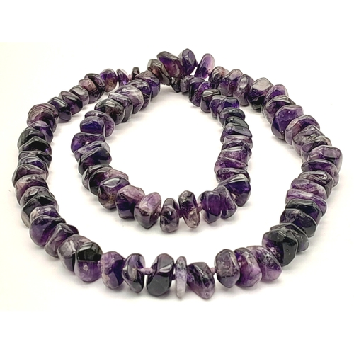 978 - A stunning matinee length Amethyst chunky stone set necklace. Total length 70cm. Please see photos f... 