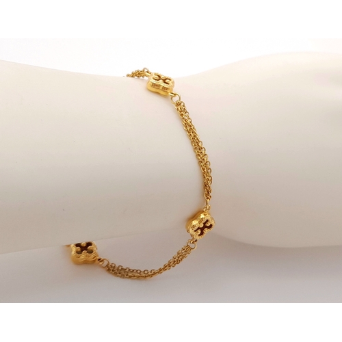 1323 - 18K YELLOW GOLD 2 STRAND CLOVER DESIGN BRACELET 4.2G. REF: TAN 6020