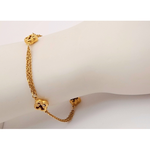 1323 - 18K YELLOW GOLD 2 STRAND CLOVER DESIGN BRACELET 4.2G. REF: TAN 6020