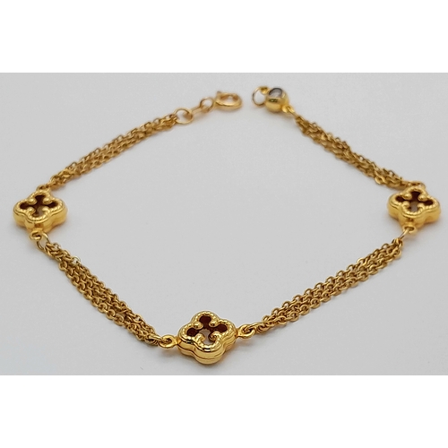 1323 - 18K YELLOW GOLD 2 STRAND CLOVER DESIGN BRACELET 4.2G. REF: TAN 6020