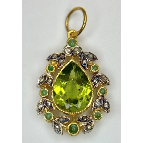 1732 - A Gilt Sterling Silver Pendant with: 1.5ct peridot, 0.12ctw diamonds and 0.18ctw emeralds. 14k gold ... 