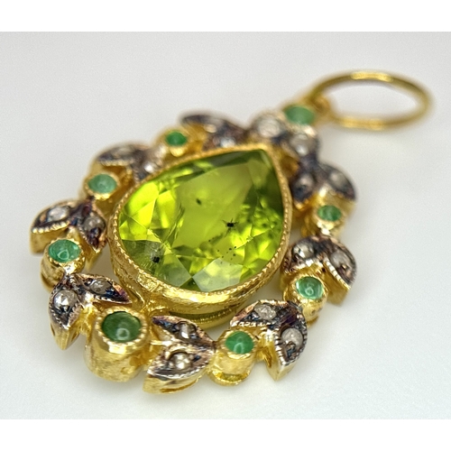 1732 - A Gilt Sterling Silver Pendant with: 1.5ct peridot, 0.12ctw diamonds and 0.18ctw emeralds. 14k gold ... 