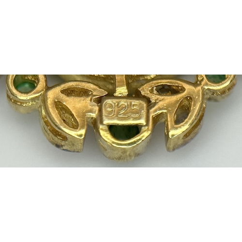 1732 - A Gilt Sterling Silver Pendant with: 1.5ct peridot, 0.12ctw diamonds and 0.18ctw emeralds. 14k gold ... 