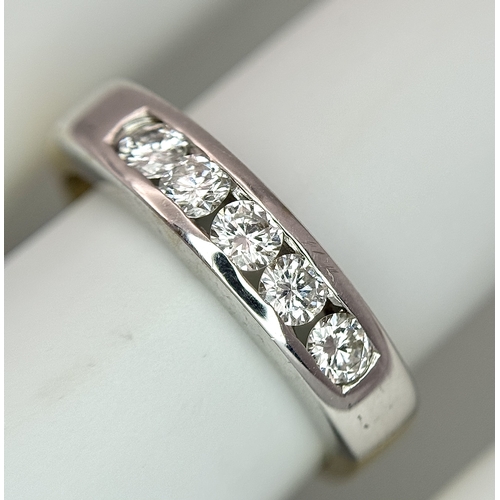 1268 - An 18K Yellow Gold Five Stone Diamond Ring. 0.50ctw of round brilliant cut channel set diamonds. Siz... 