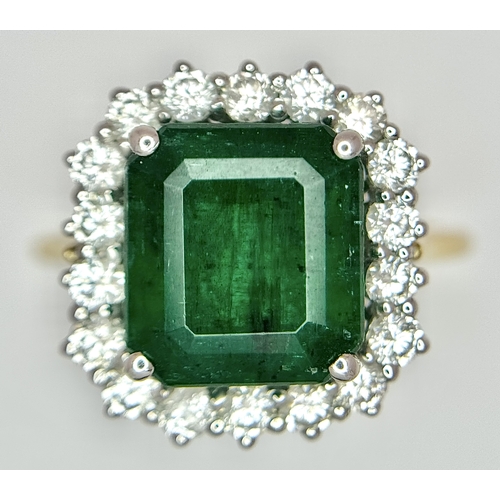 1298 - A W.G.I Certified 18K Yellow Gold, 950 Platinum, Emerald and Diamond Ring. An octagonal cut 4.05ct e... 
