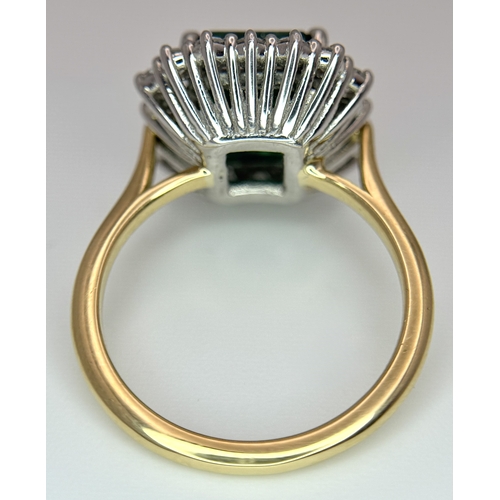 1298 - A W.G.I Certified 18K Yellow Gold, 950 Platinum, Emerald and Diamond Ring. An octagonal cut 4.05ct e... 