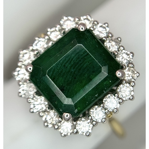 1298 - A W.G.I Certified 18K Yellow Gold, 950 Platinum, Emerald and Diamond Ring. An octagonal cut 4.05ct e... 
