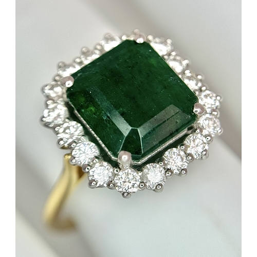 1298 - A W.G.I Certified 18K Yellow Gold, 950 Platinum, Emerald and Diamond Ring. An octagonal cut 4.05ct e... 