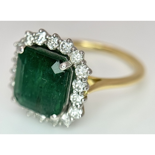 1298 - A W.G.I Certified 18K Yellow Gold, 950 Platinum, Emerald and Diamond Ring. An octagonal cut 4.05ct e... 