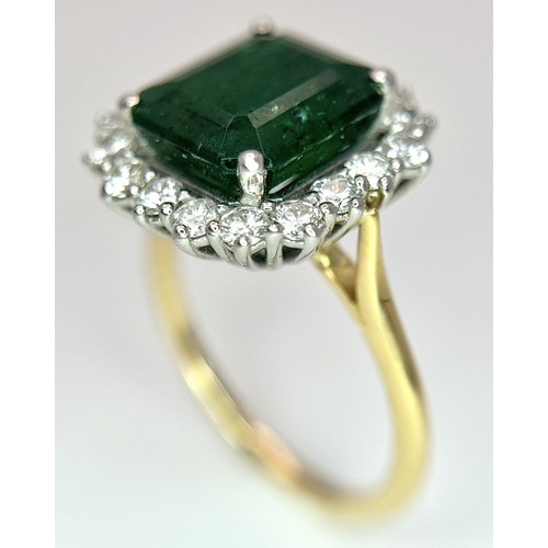 1298 - A W.G.I Certified 18K Yellow Gold, 950 Platinum, Emerald and Diamond Ring. An octagonal cut 4.05ct e... 