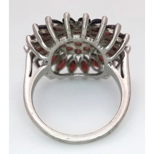 1707 - A STERLING SILVER GARNET SET CLUSTER RING. 5.1G. SIZE N. SC6108.