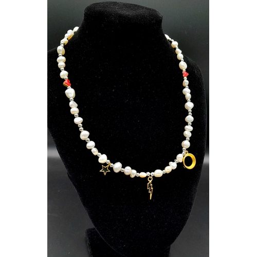 1489 - A pretty Freshwater Pearl link T-bar necklace with enamelled charms. Total length 48cm.