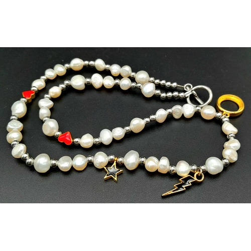 1489 - A pretty Freshwater Pearl link T-bar necklace with enamelled charms. Total length 48cm.
