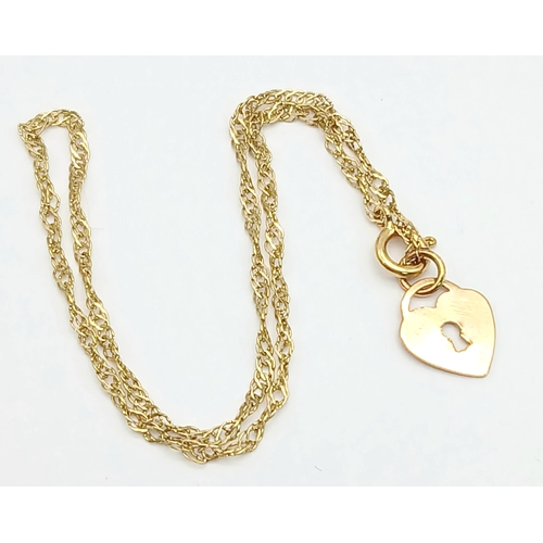 21 - 9 CARAT GOLD FINE CHAIN BRACELET with CHARM. 0.5 Grams . 17 cm.
