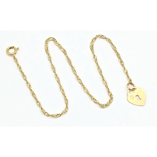 21 - 9 CARAT GOLD FINE CHAIN BRACELET with CHARM. 0.5 Grams . 17 cm.