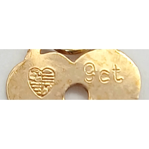21 - 9 CARAT GOLD FINE CHAIN BRACELET with CHARM. 0.5 Grams . 17 cm.