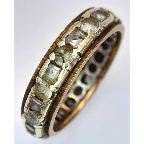 1702 - A Vintage 9K Gold Stone Set Eternity Ring. Size O. 3.5g.