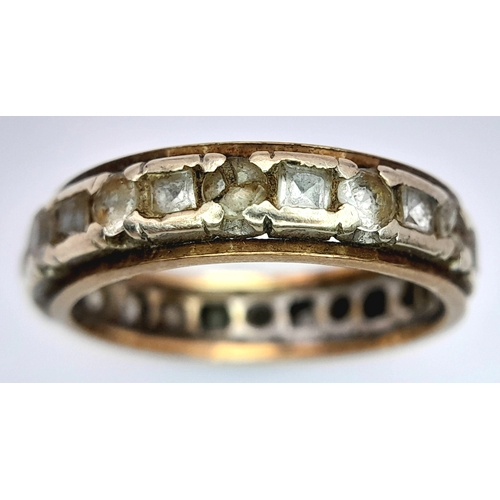 1702 - A Vintage 9K Gold Stone Set Eternity Ring. Size O. 3.5g.