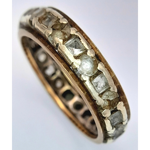 1702 - A Vintage 9K Gold Stone Set Eternity Ring. Size O. 3.5g.