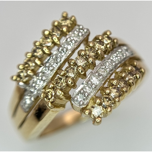 1755 - A 9K Yellow Gold Diamond Crossover Ring. 4.4g total weight. 0.36ctw diamonds. Ring size O. Ref: 7722... 